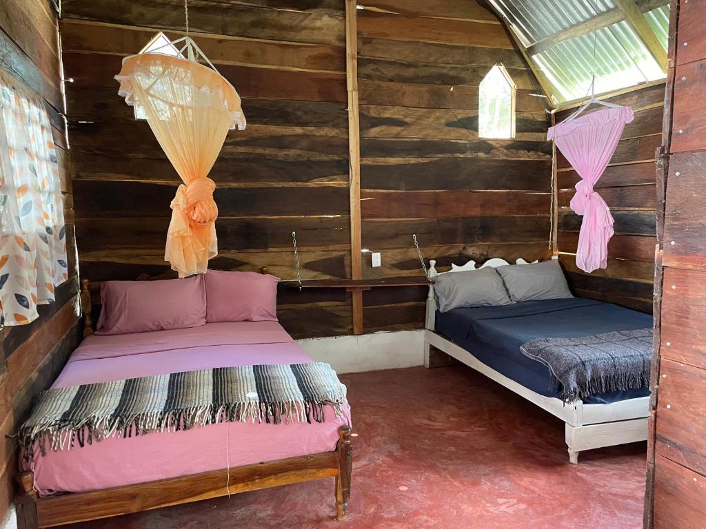 Postel nebo postele na pokoji v ubytování CASADOS RANCH