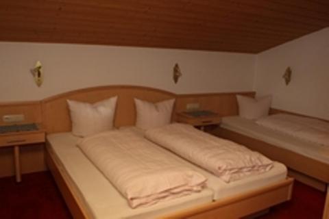 Postel nebo postele na pokoji v ubytování Hotel Garni Sonnenheim