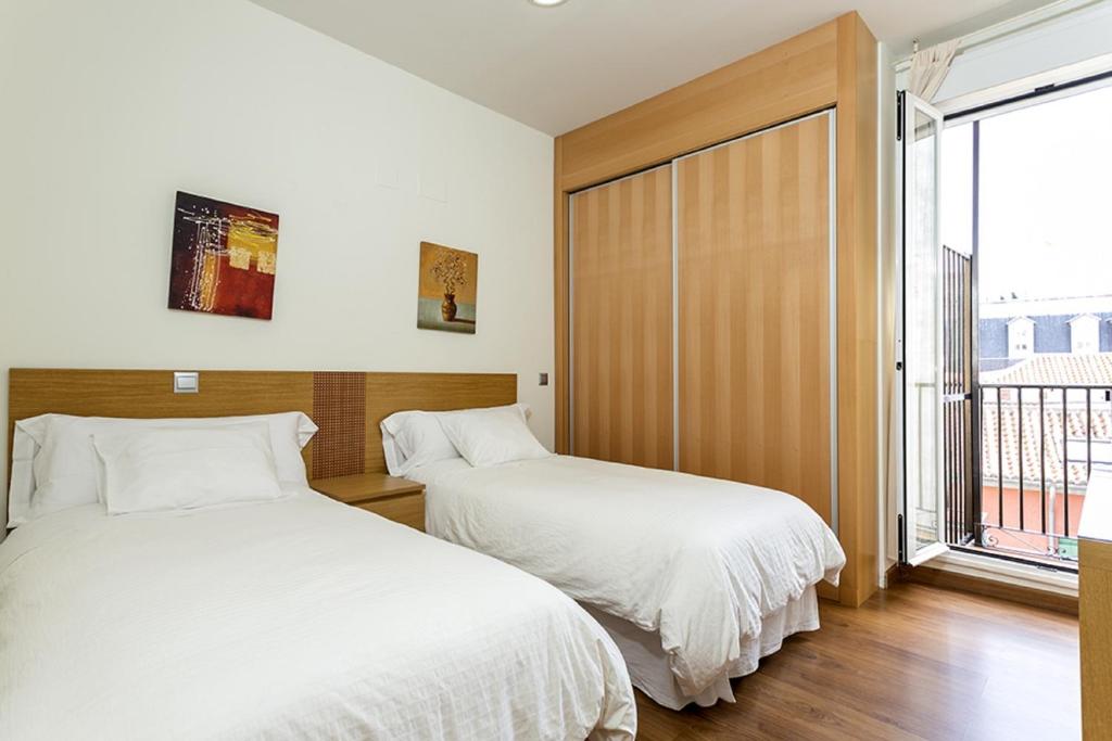 Postel nebo postele na pokoji v ubytování Apartments Center Madrid
