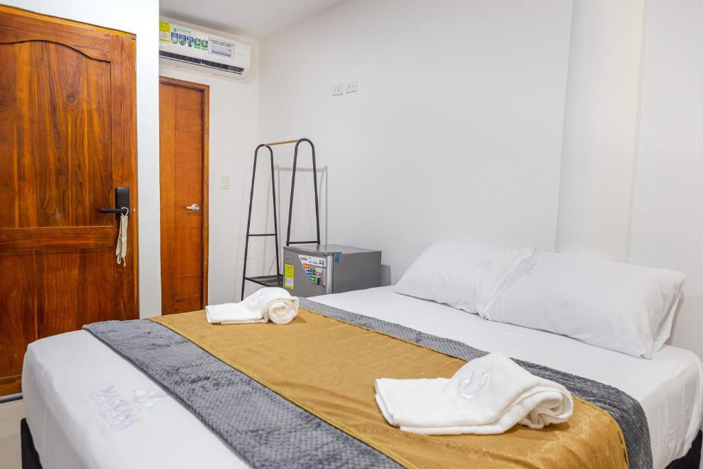 Postel nebo postele na pokoji v ubytování Markasa Hotel boutique