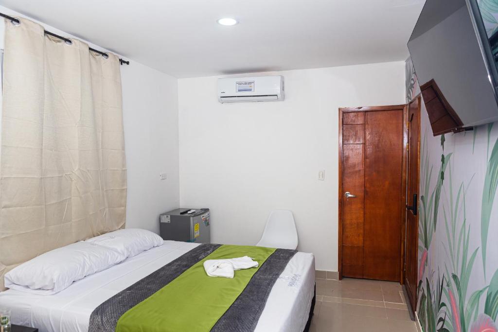 Postel nebo postele na pokoji v ubytování Markasa Hotel boutique