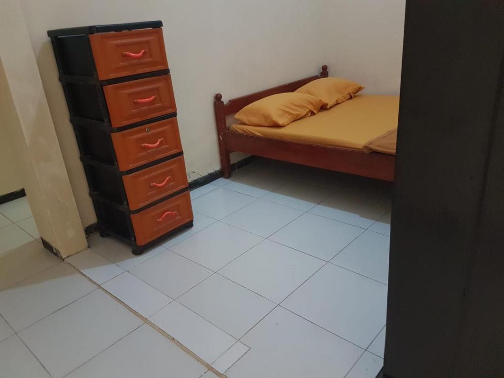 Postel nebo postele na pokoji v ubytování Selaras Kost Syariah