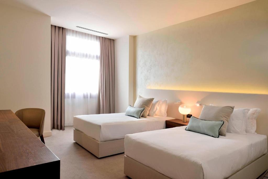 Postel nebo postele na pokoji v ubytování JW Marriott Venice Resort & Spa
