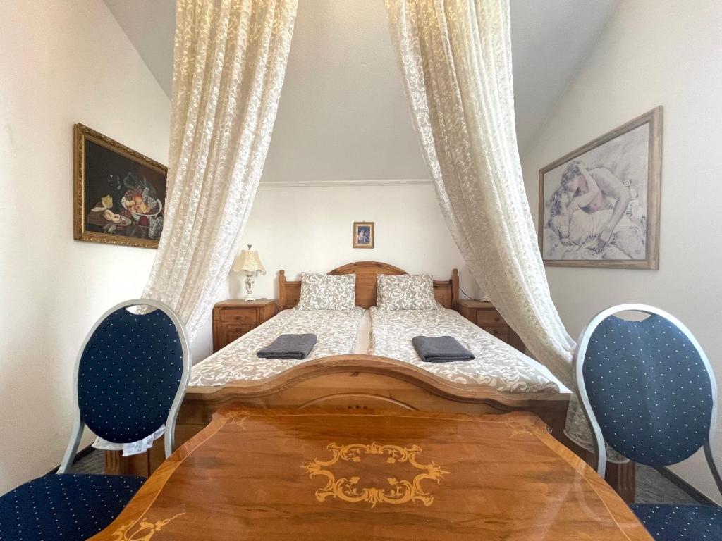 Posteľ alebo postele v izbe v ubytovaní Luxi Romantik Apartments
