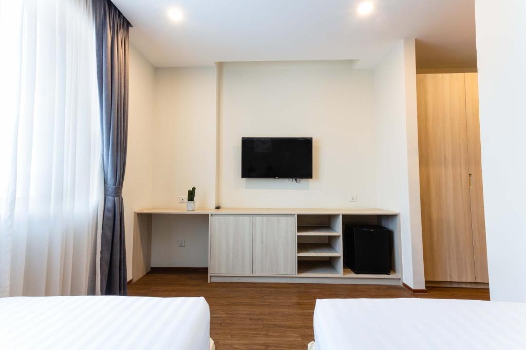 TV a/nebo společenská místnost v ubytování Joli Hotel