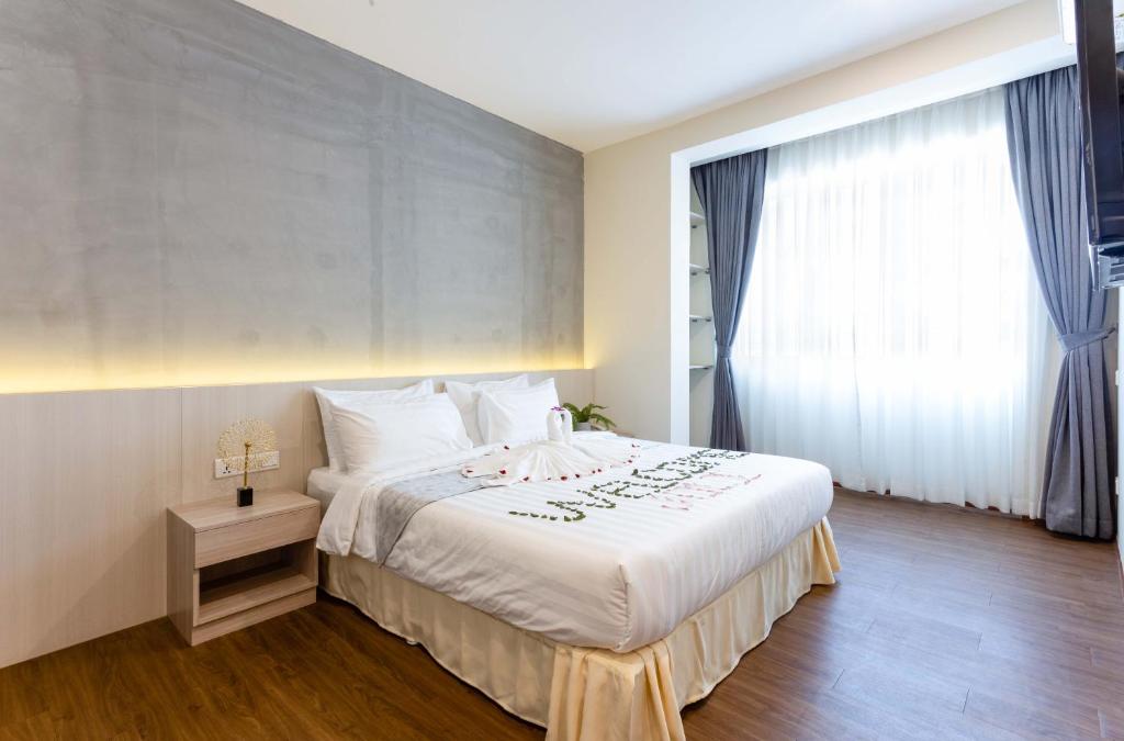 Postel nebo postele na pokoji v ubytování Joli Hotel