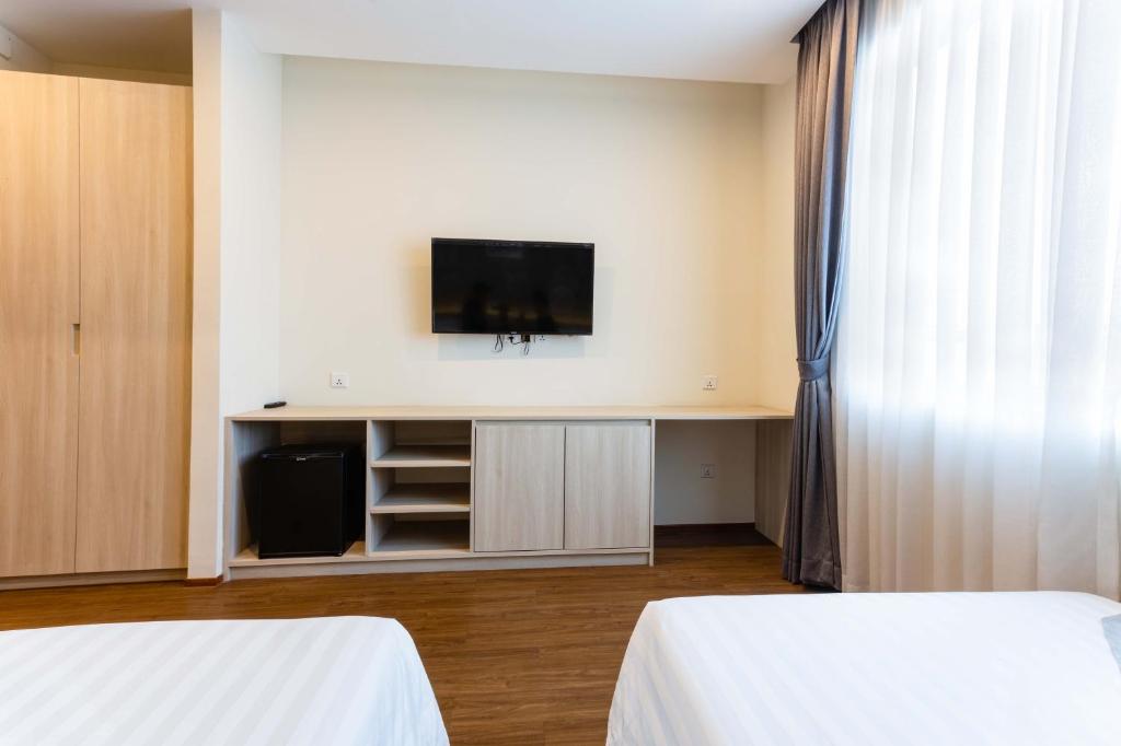 Postel nebo postele na pokoji v ubytování Joli Hotel