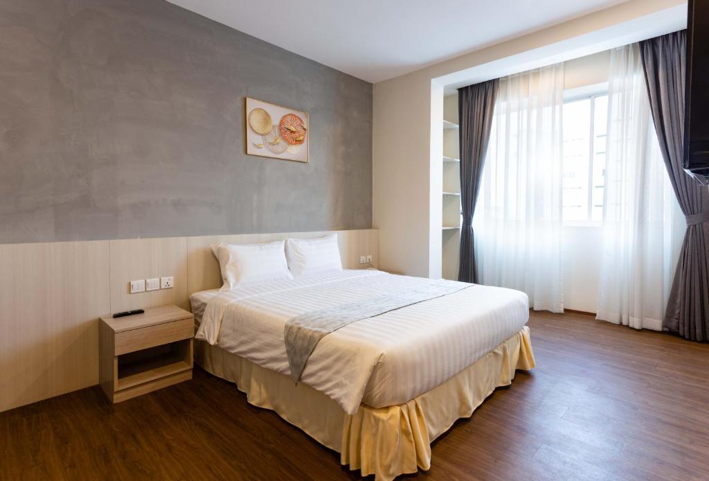 Postel nebo postele na pokoji v ubytování Joli Hotel