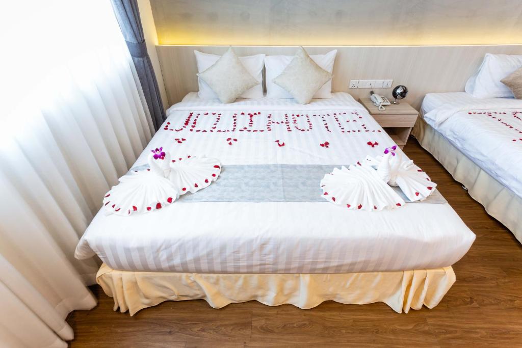 Postel nebo postele na pokoji v ubytování Joli Hotel
