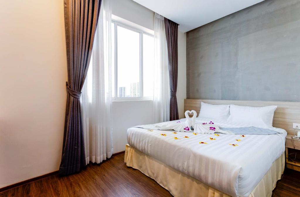 Postel nebo postele na pokoji v ubytování Joli Hotel