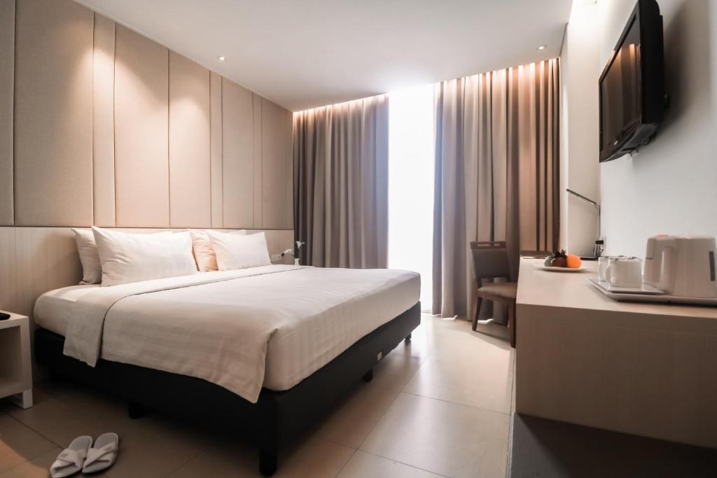 Postel nebo postele na pokoji v ubytování PRIME PARK Hotel Bandung