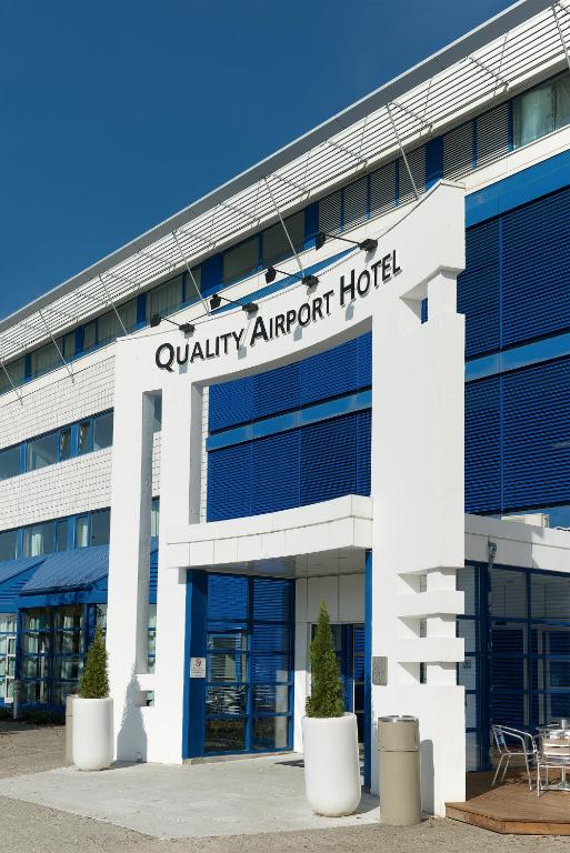 an office building with a sign that reads quality airport hotel at Quality Airport Hotel Stavanger in Sola