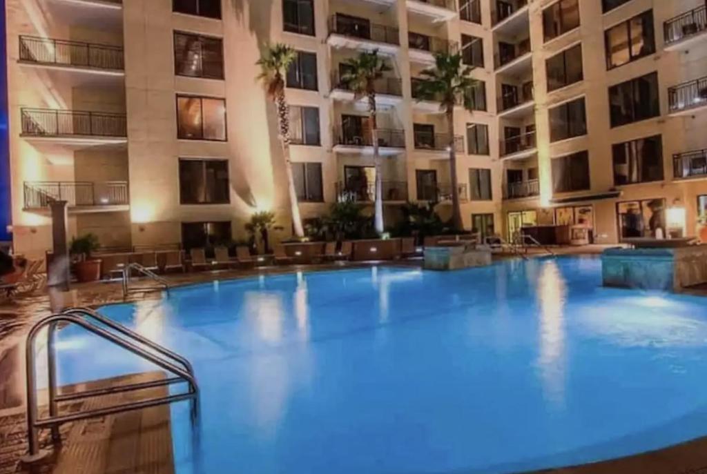 a large swimming pool in front of a building at Origin at Seahaven in Panama City Beach