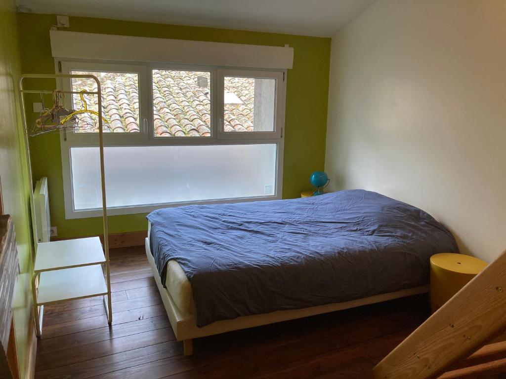 Postel nebo postele na pokoji v ubytování La Mezzanine