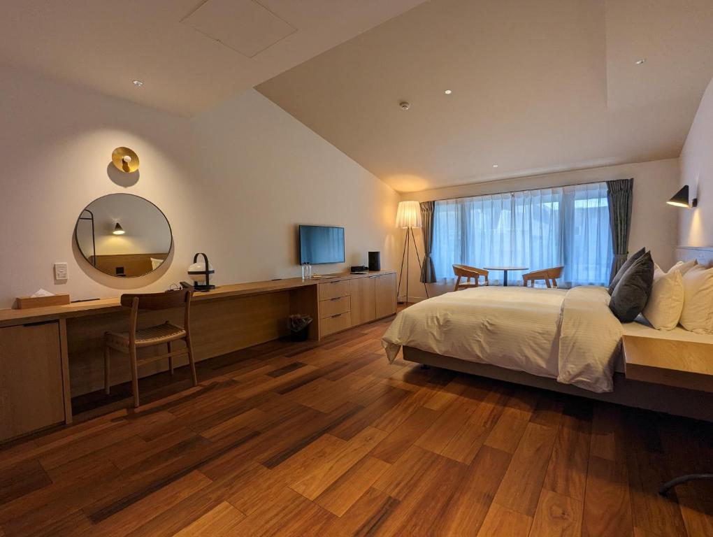 Postel nebo postele na pokoji v ubytování BIRD HOTEL