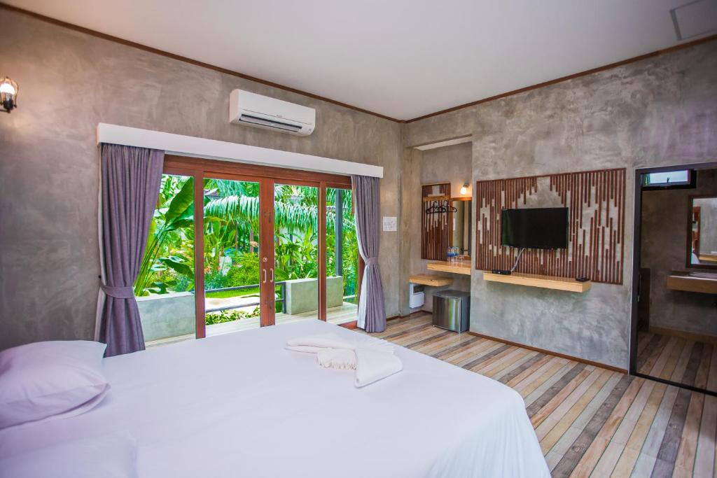 TV a/nebo společenská místnost v ubytování Palm Pran Resort