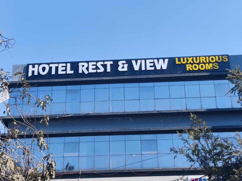 a sign on top of a hotel resort and view rooms at HOTEL RESTANDVIEW in Anand