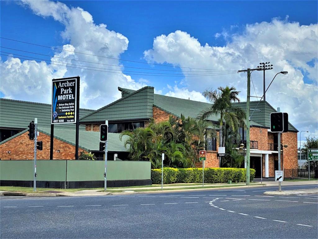 a building with a sign on the side of a street at Archer Park Motel in Rockhampton