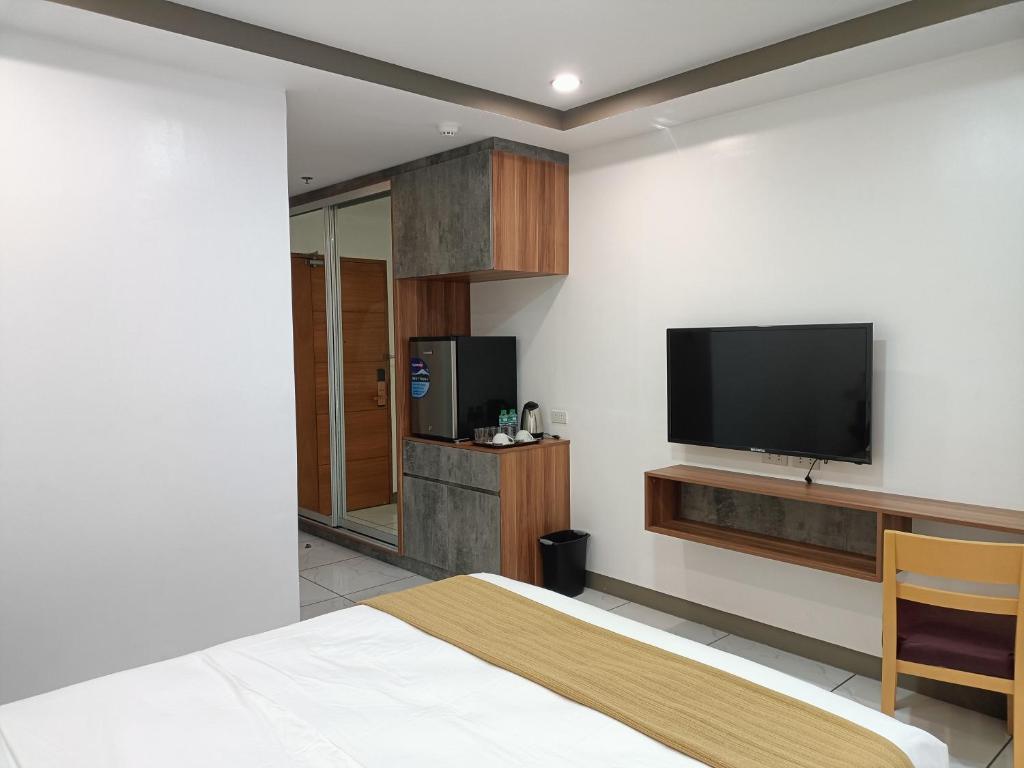 TV a/nebo společenská místnost v ubytování Rosh Hotel