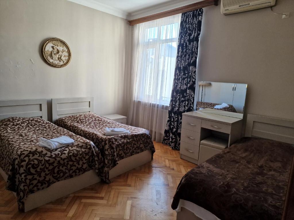 Postel nebo postele na pokoji v ubytování CATTALEYA