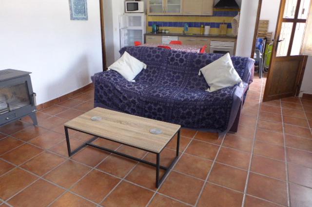 a living room with a couch and a coffee table at Cuevas Don Alvaro y Romaide 