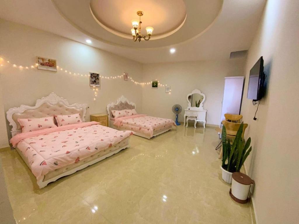 Postel nebo postele na pokoji v ubytování Villa Đà Lạt GD - Biệt Thự Đà Lạt GD Gần Hồ Xuân Hương Gần Chợ