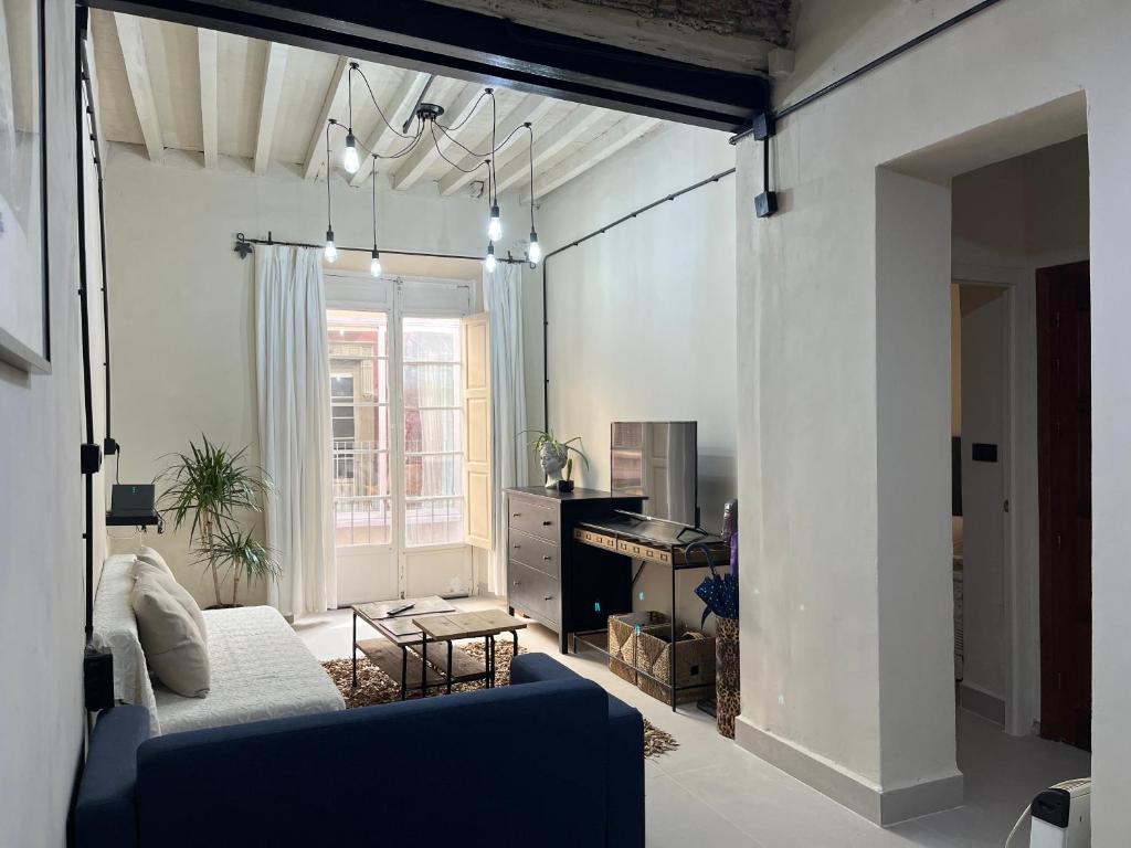 Televízia a/alebo spoločenská miestnosť v ubytovaní Apartamento Málaga Centro Tritón