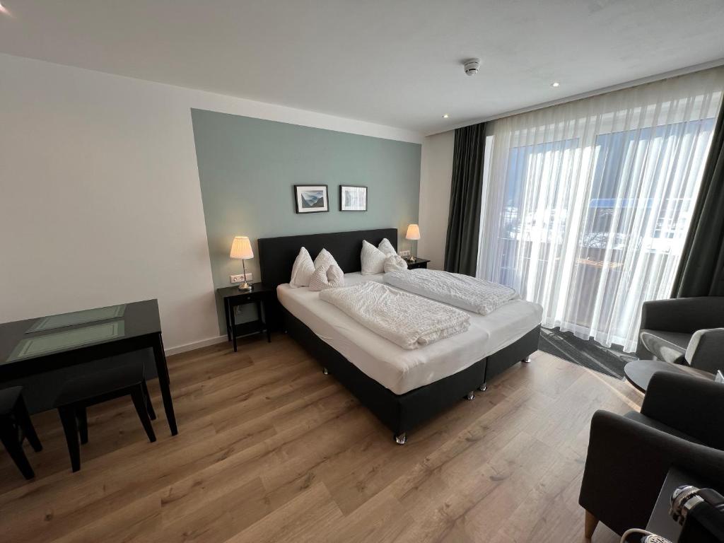 Postel nebo postele na pokoji v ubytování Hotel Berghof