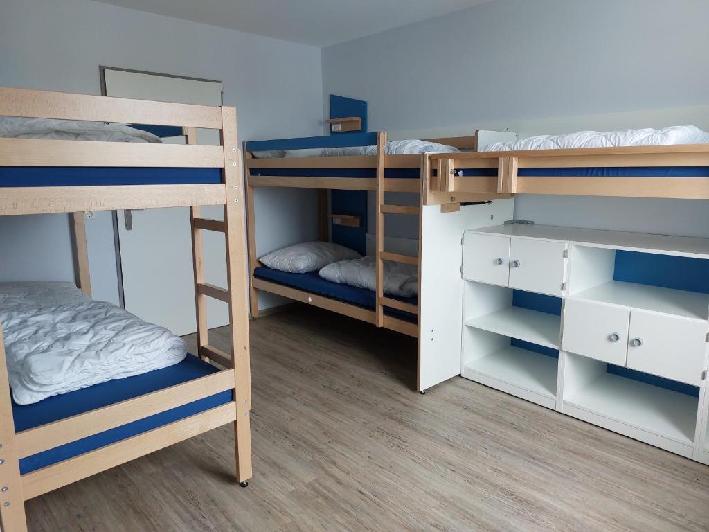 Postel nebo postele na pokoji v ubytování CVJM Freizeithaus MS Waterdelle