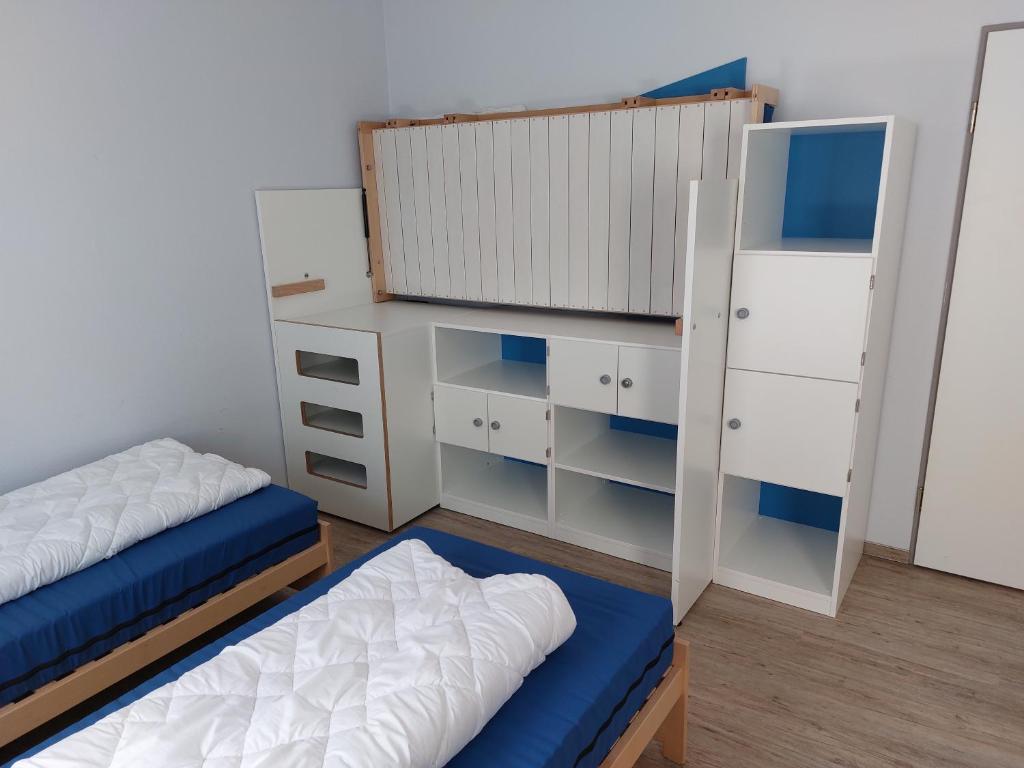 Postel nebo postele na pokoji v ubytování CVJM Freizeithaus MS Waterdelle
