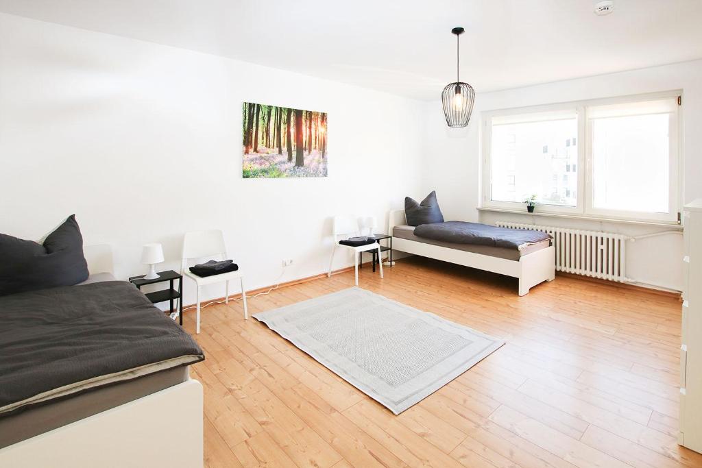 a living room with a couch and a table at beautiful 3-room apartment in Wetzlar