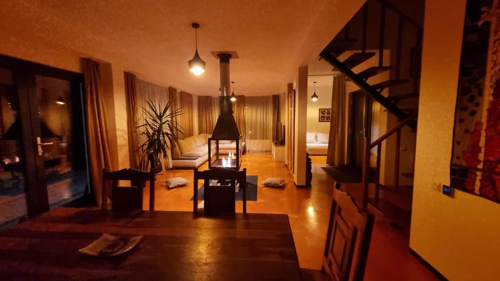 a view of a living room with a table and a couch at Mountain Home Bran in Bran
