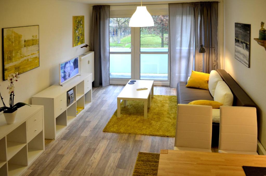 a living room with a couch and a table at F2 - Am alten Elbarm - Laubegast in Dresden