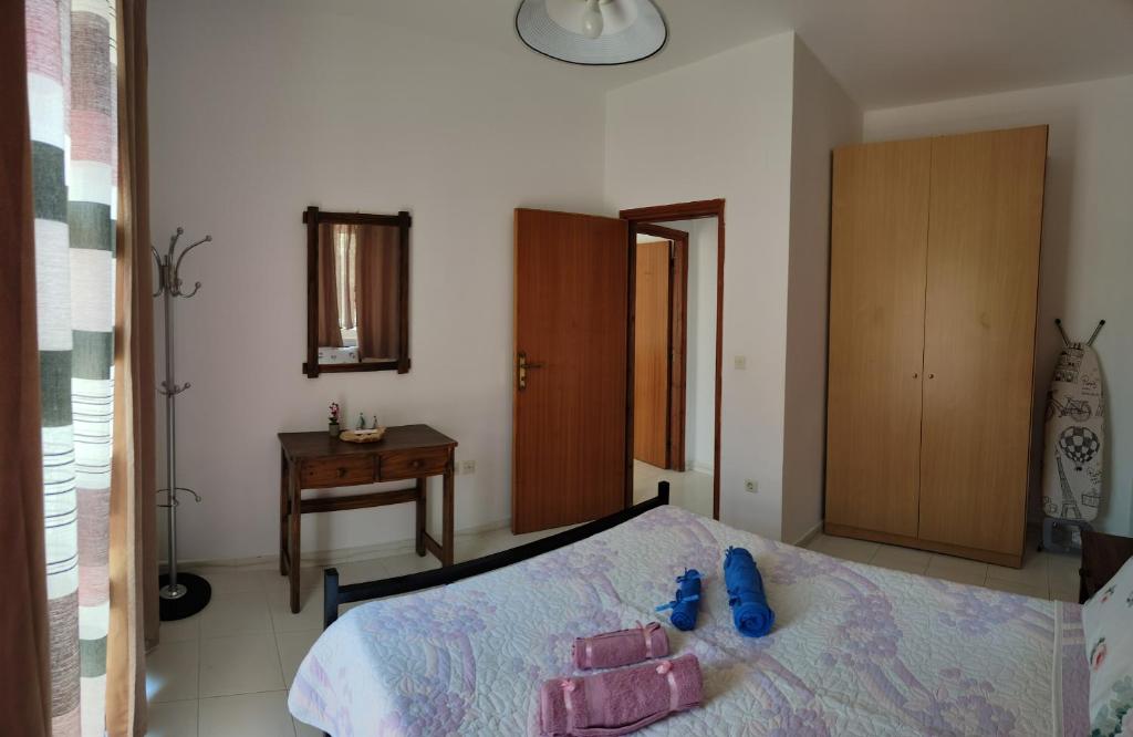 Łóżko lub łóżka w pokoju w obiekcie Hibiscus Green Apartments