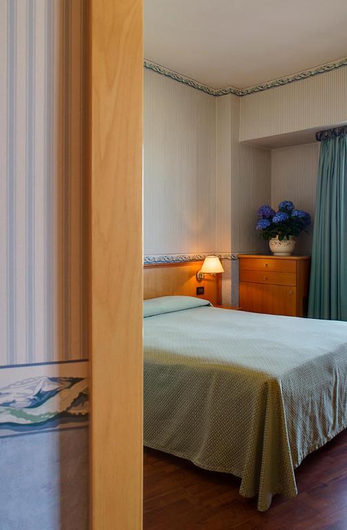 Кровать или кровати в номере Hotel Palace