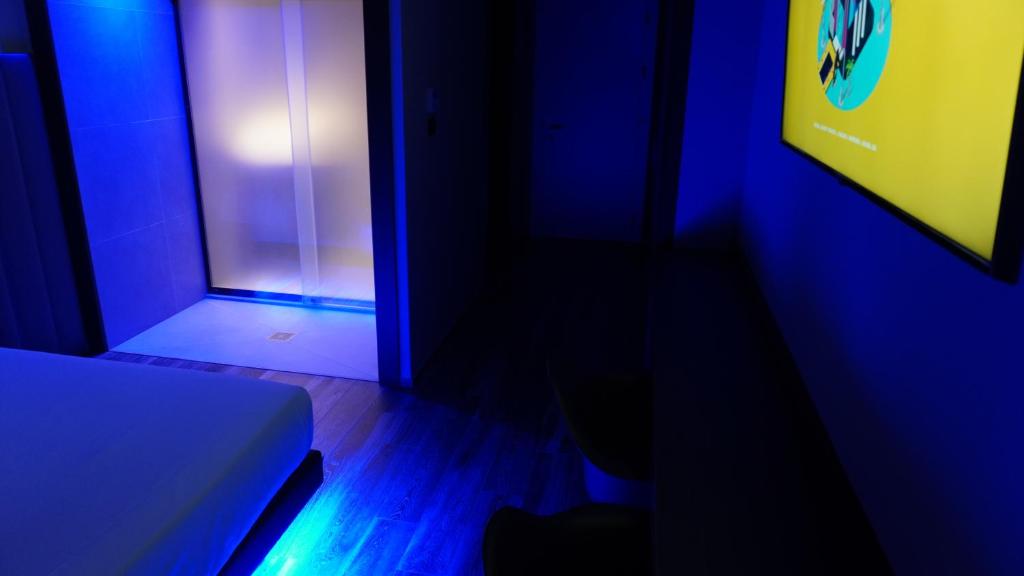 Postel nebo postele na pokoji v ubytování Leoni Hotel & Private Spa