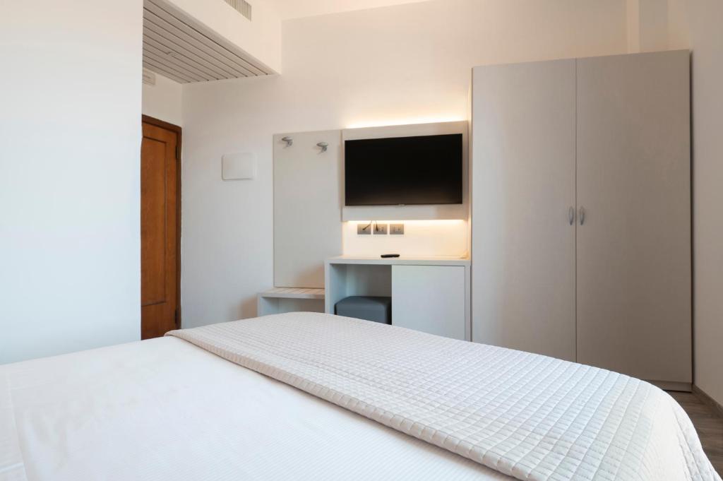 Кровать или кровати в номере Hotel Palace