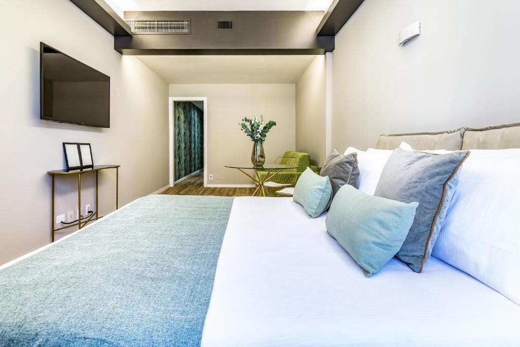 A bed or beds in a room at BePlace Apartments in Duomo