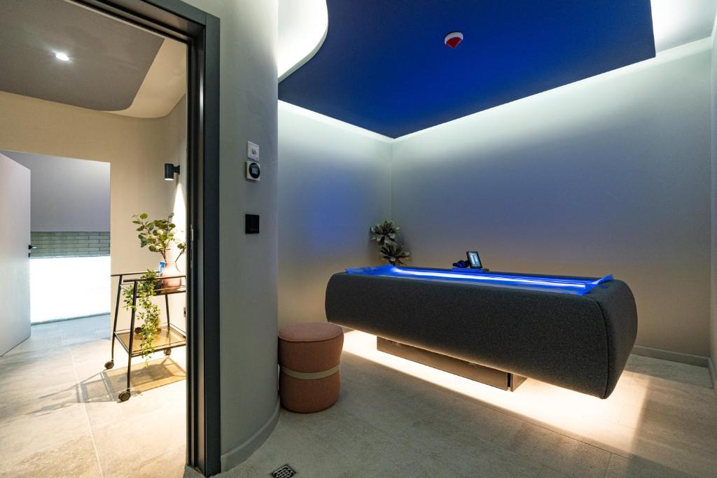 a bathtub in a room with a blue ceiling at HVD Reina del Mar - Premium Spa Service & Free Parking in Obzor