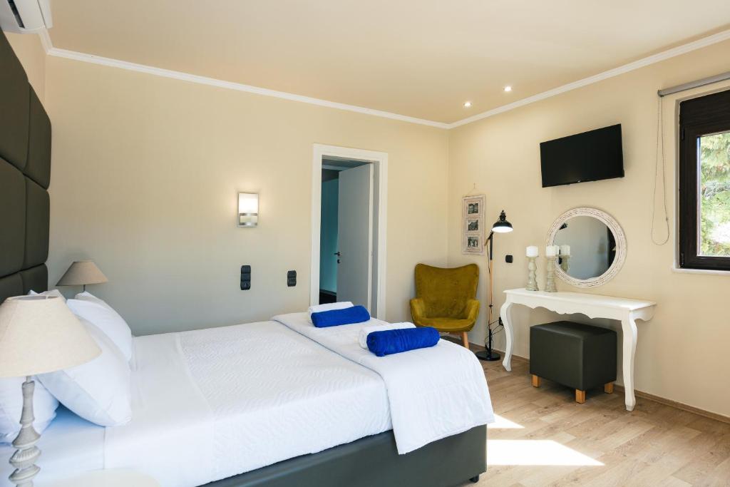 Postel nebo postele na pokoji v ubytování Akira Villa