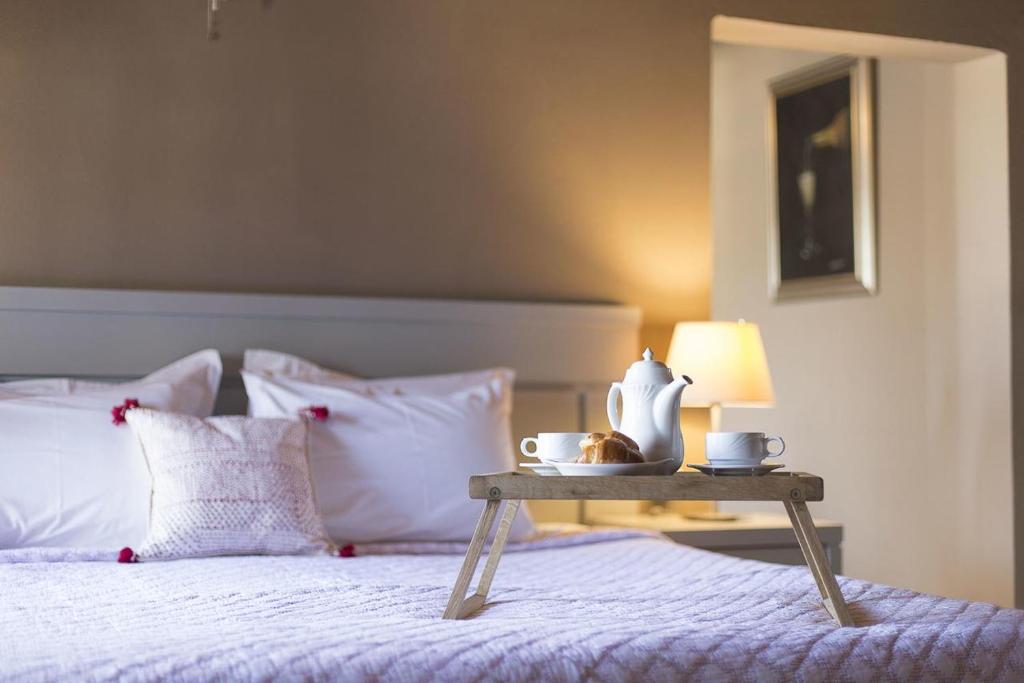 A bed or beds in a room at Nimfi Hotel, Skiathos