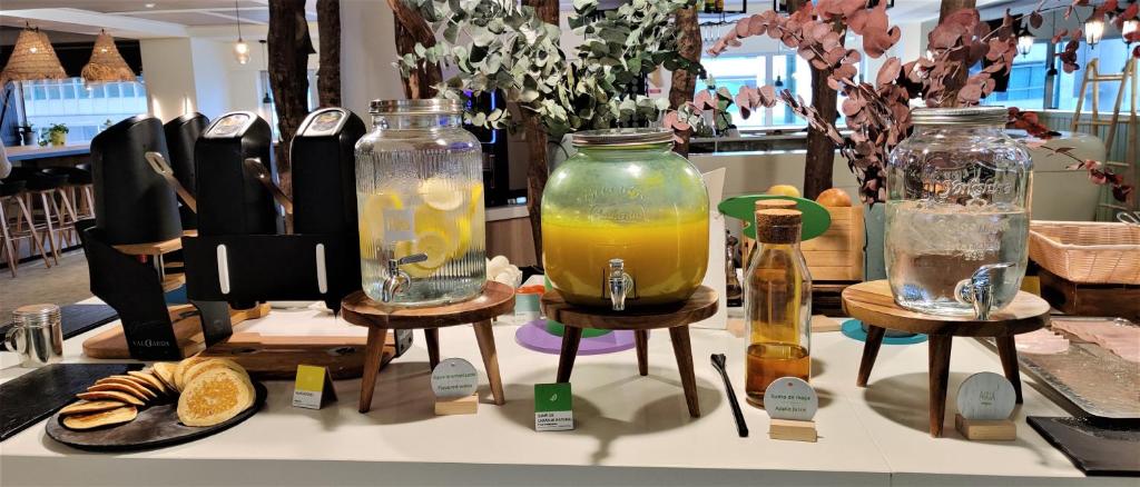 A self-service drinks station with infused water, juice and breakfast snacks.