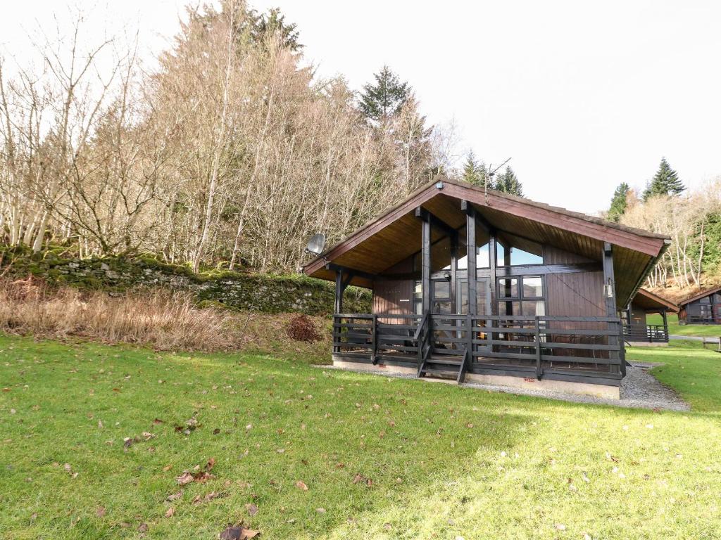 a pavilion in a park with a grass field at Firbush Lodge in Killin