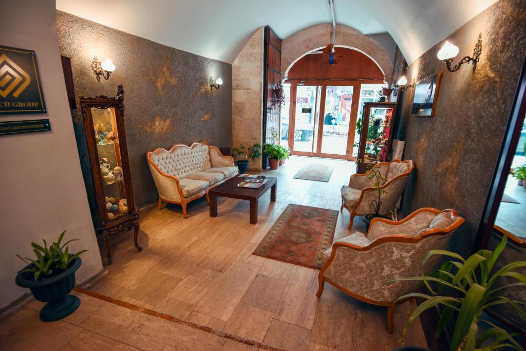 Postel nebo postele na pokoji v ubytování Taşhan Hotel