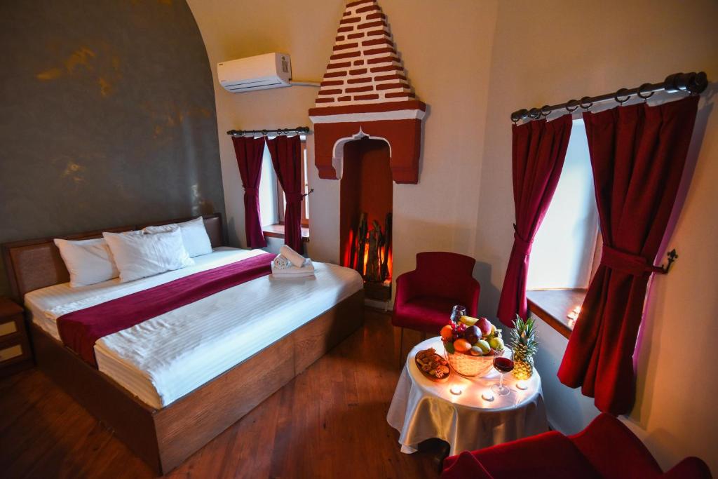 Postel nebo postele na pokoji v ubytování Taşhan Hotel