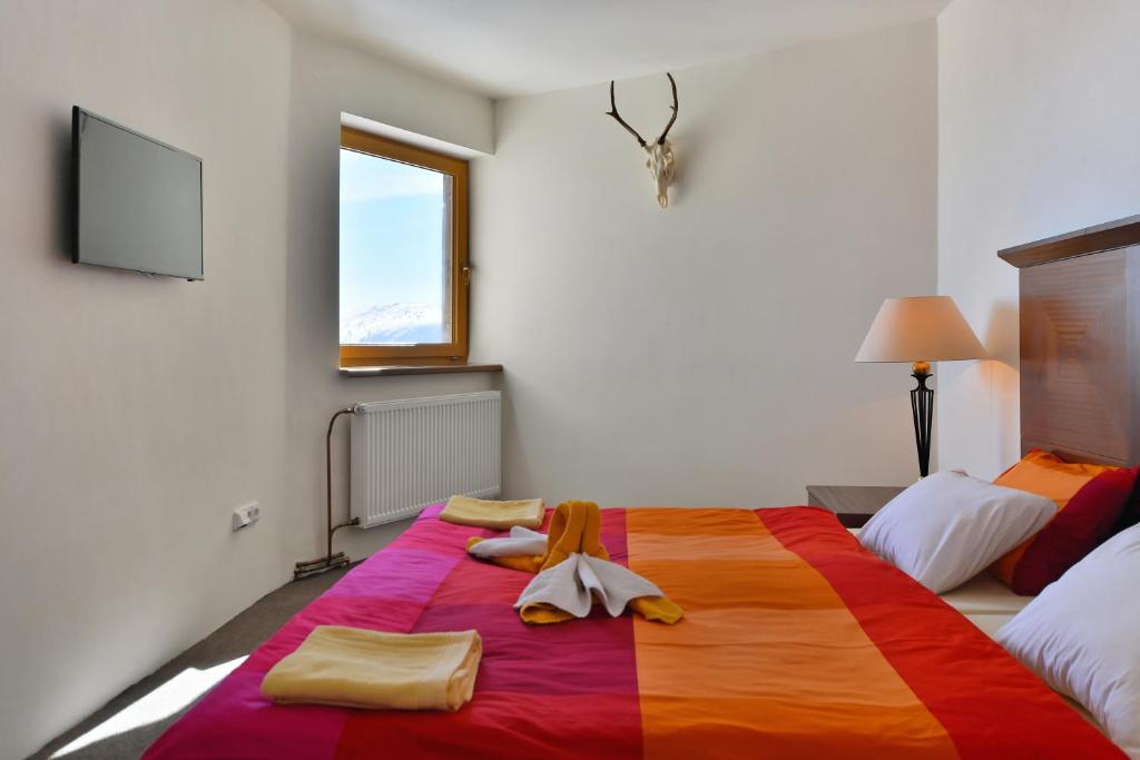 Postel nebo postele na pokoji v ubytování Hotel Labská bouda