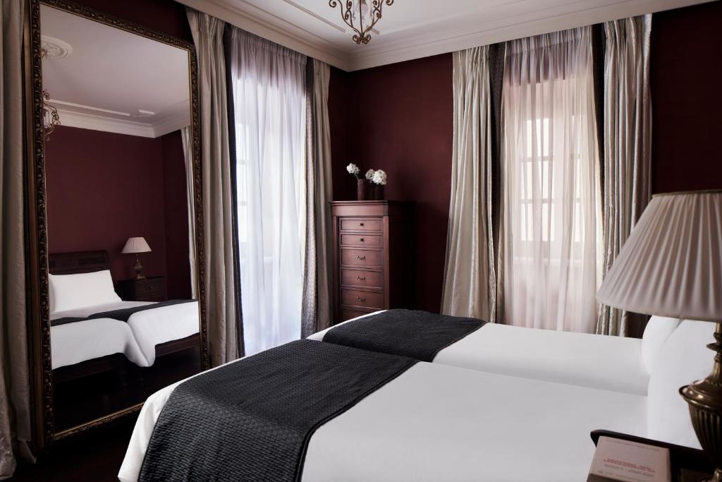 Postel nebo postele na pokoji v ubytování Hotel Ippoliti