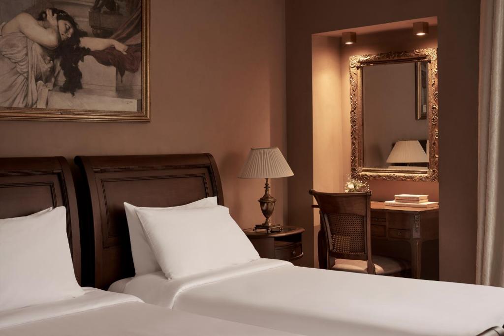Postel nebo postele na pokoji v ubytování Hotel Ippoliti