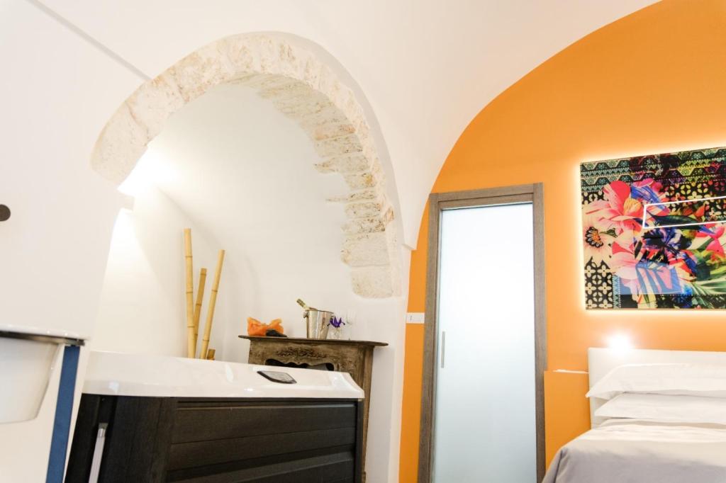 Postel nebo postele na pokoji v ubytování Ostuni Luxury Room