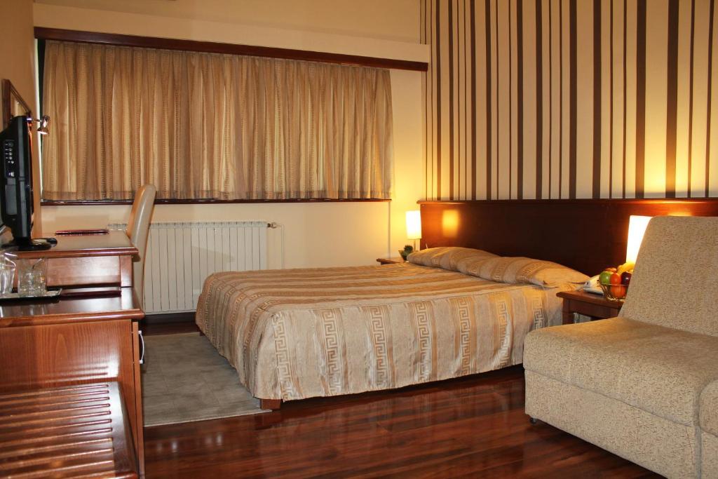 Postel nebo postele na pokoji v ubytování Hotel Centar